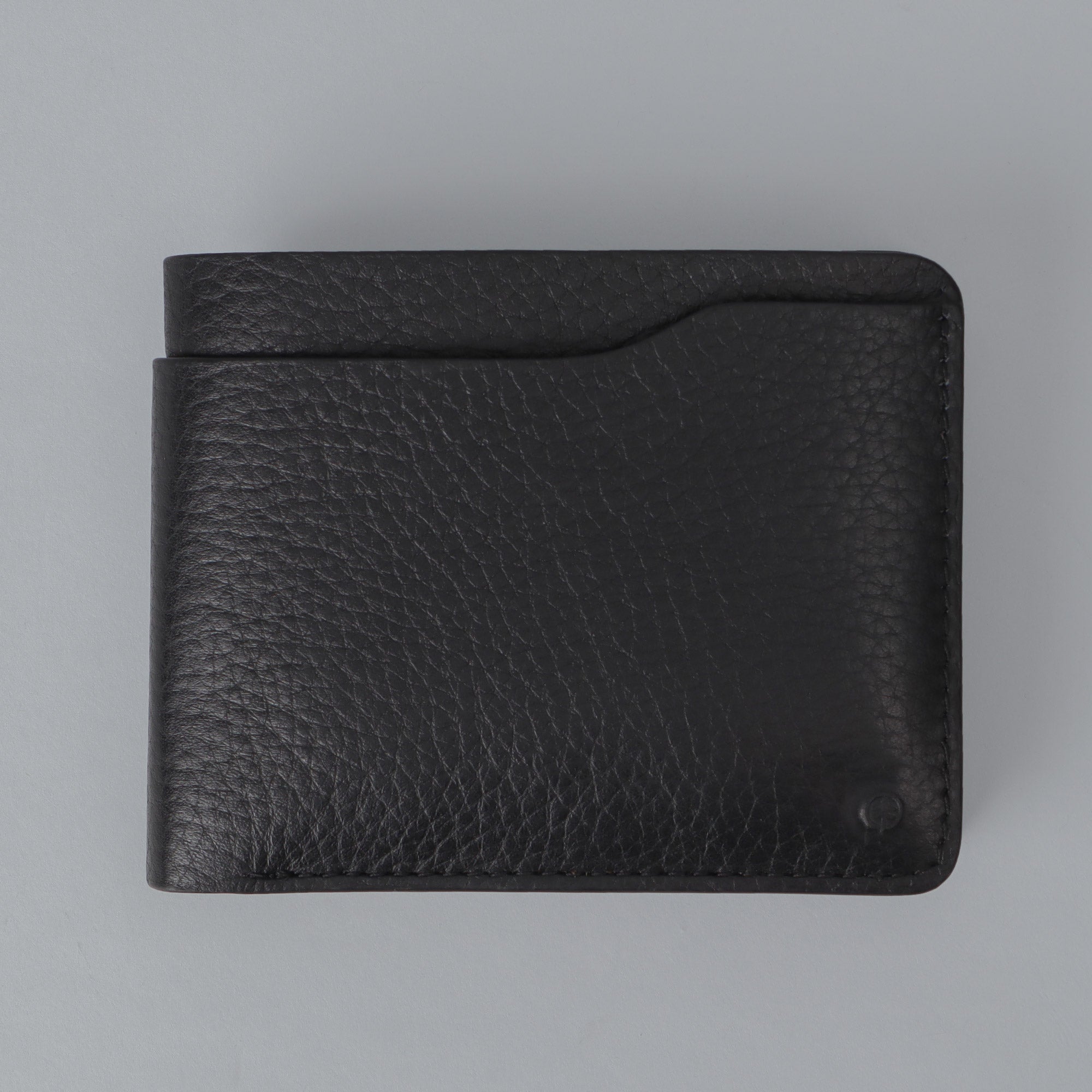 Max Wallet made from premium full grain leather with multiple pockets for cards and cash, featuring antique brass hardware.