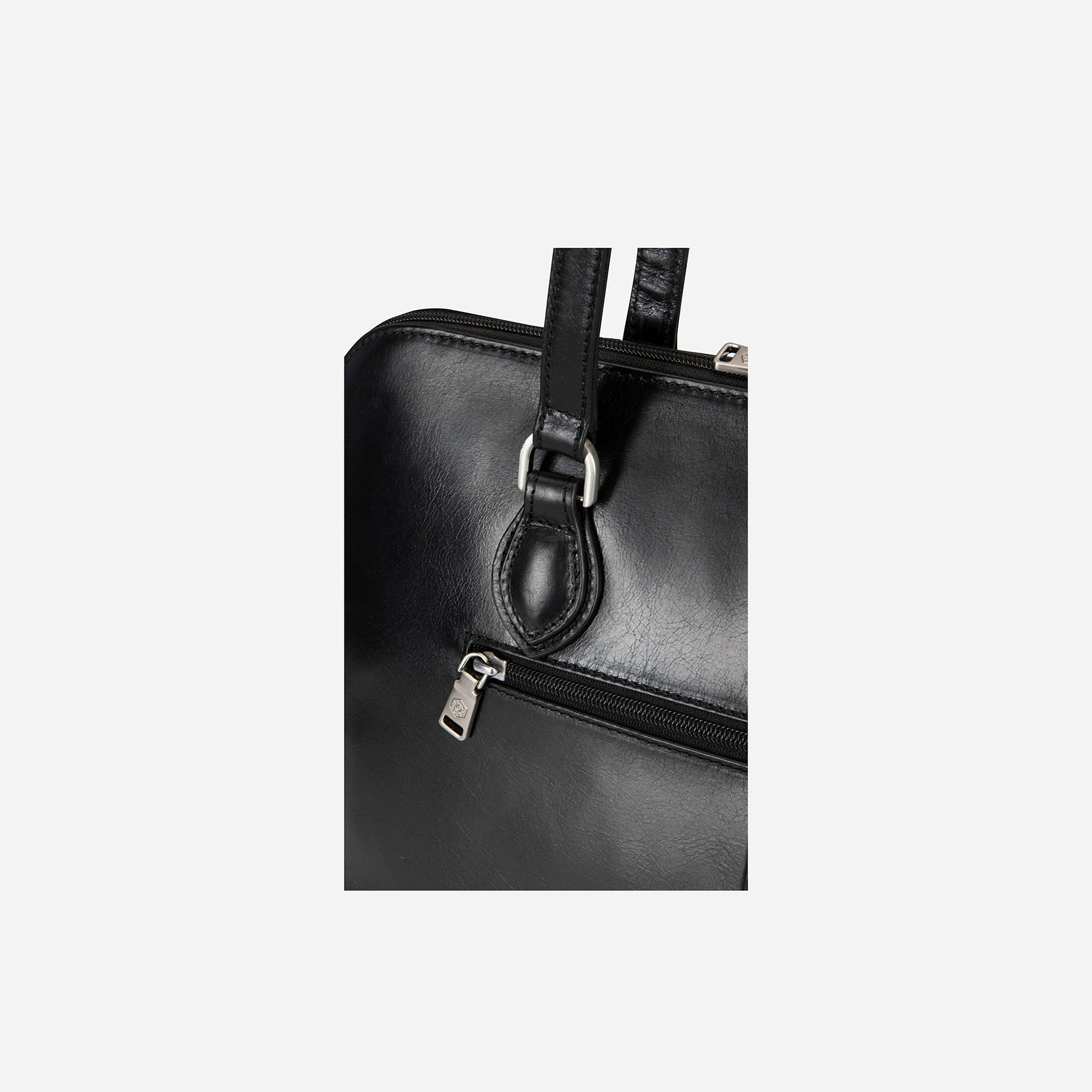 Medium 15-inch black leather laptop handbag with elegant design and spacious interior.