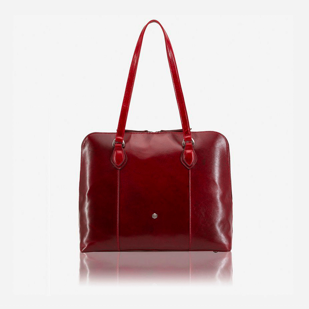 Medium leather laptop handbag in rust color, showcasing its elegant design and spacious interior.