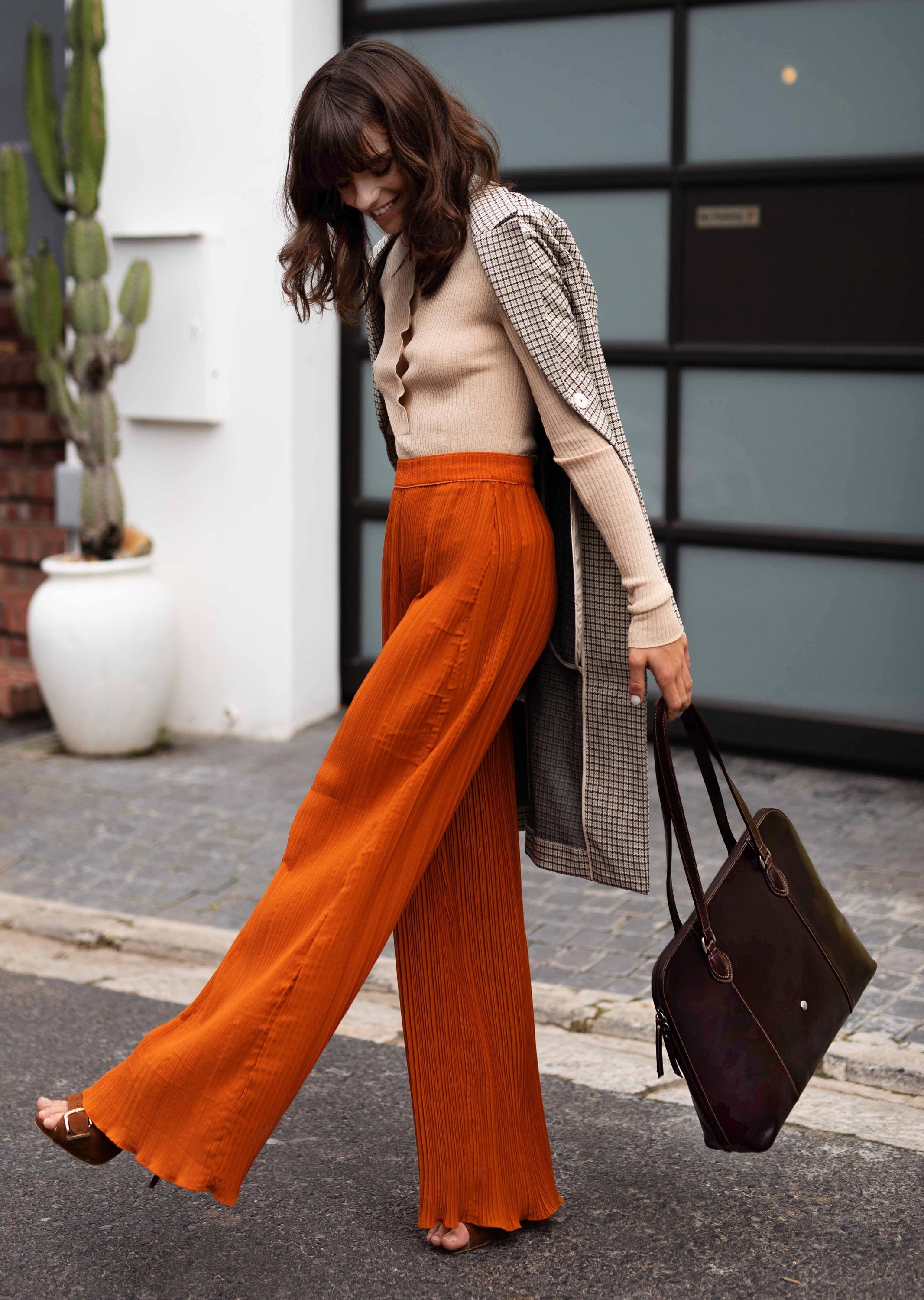 Medium Leather Laptop Handbag in Tobacco color, showcasing its elegant design and spacious interior.