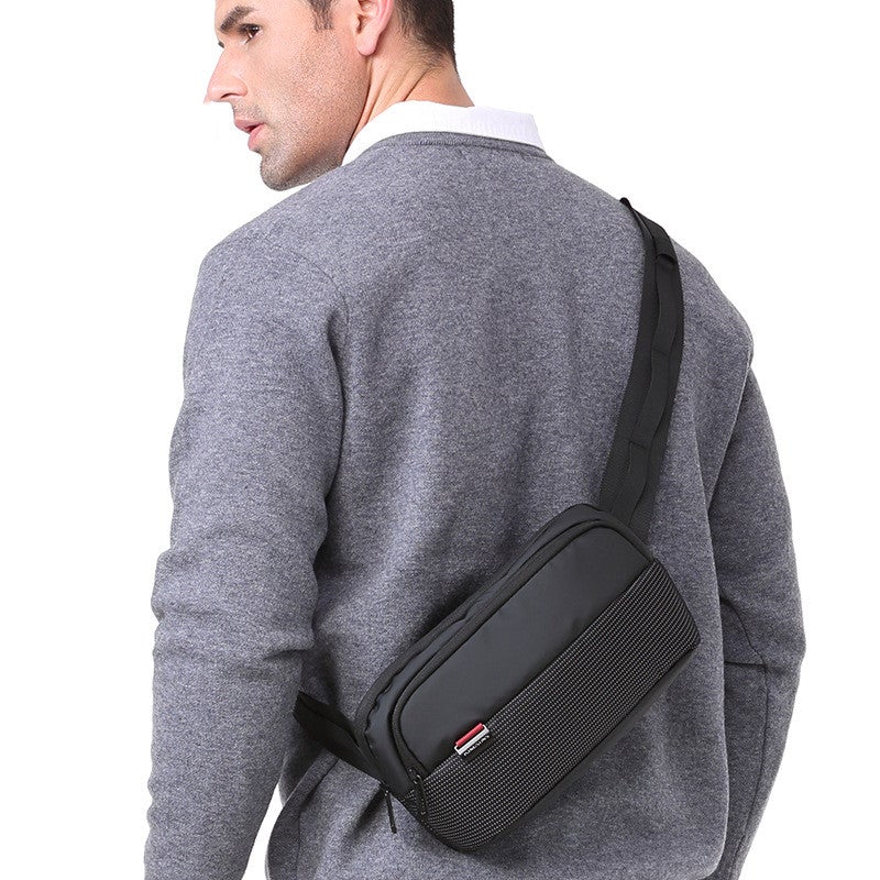 Men's Black Multipurpose Chest Bag made of nylon with multiple pockets and zipper closure, designed for style and functionality.