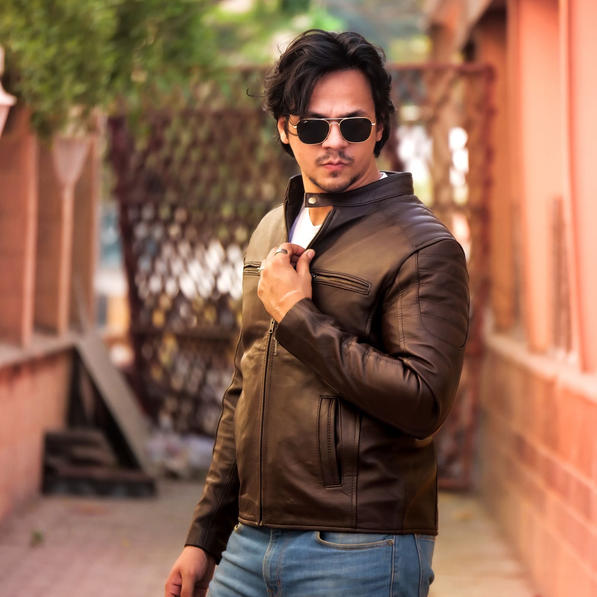 Mens Brown Lambskin Biker Style Leather Jacket featuring a front zip fastener and snap button collar, made from 100% real lambskin leather.