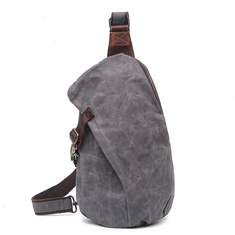 Men's Canvas Retro Crossbody Bag in a stylish dumpling shape, featuring a magnetic buckle and waterproof design.