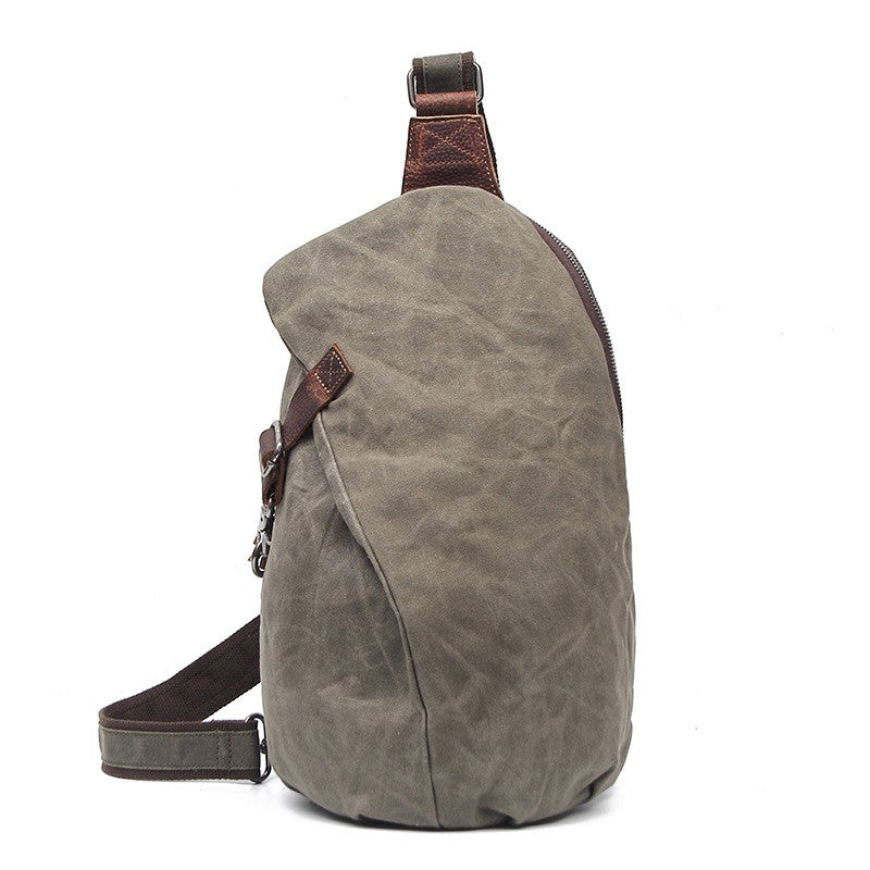 Men's Canvas Retro Crossbody Bag in a stylish dumpling shape, featuring a magnetic buckle and waterproof design.