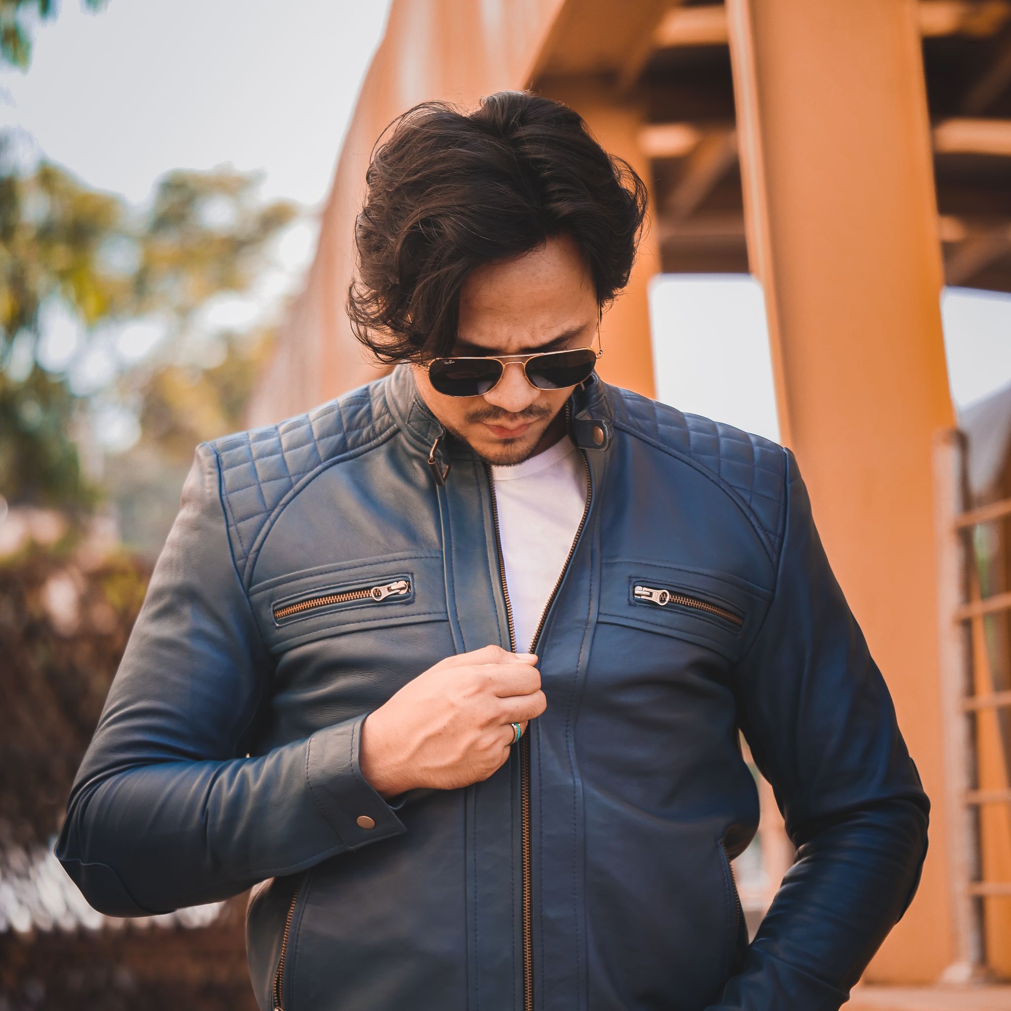 Men's Casual Signature Diamond Lambskin Leather Jacket in Blue, featuring a quilted diamond pattern and multiple zip pockets.