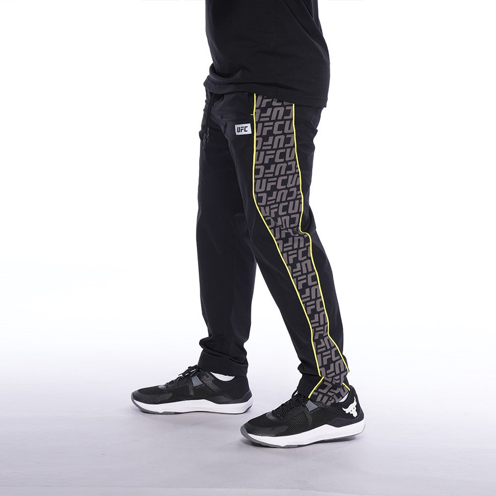 Men's UFC Logo Wave Pant in Black, featuring a relaxed fit and UFC logo monogram design, perfect for comfort and style.