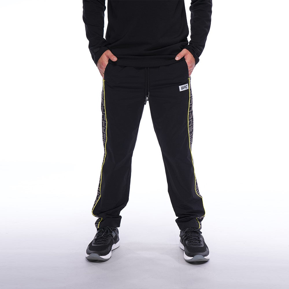 Men's UFC Logo Wave Pant in Black, featuring a relaxed fit and UFC logo monogram design, perfect for comfort and style.