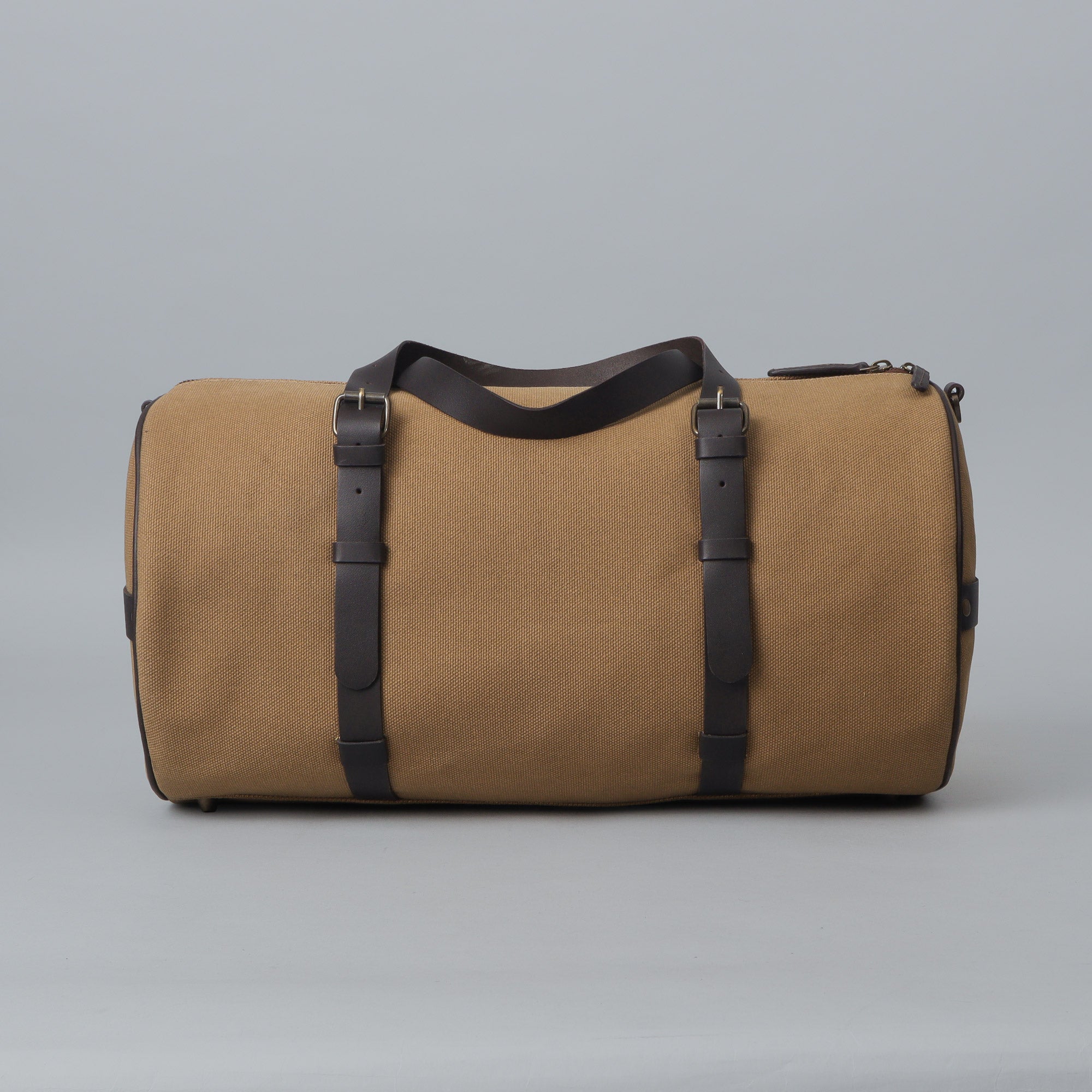 Miami Canvas Gym Bag featuring durable cotton canvas, leather straps, and spacious compartments for gym essentials.