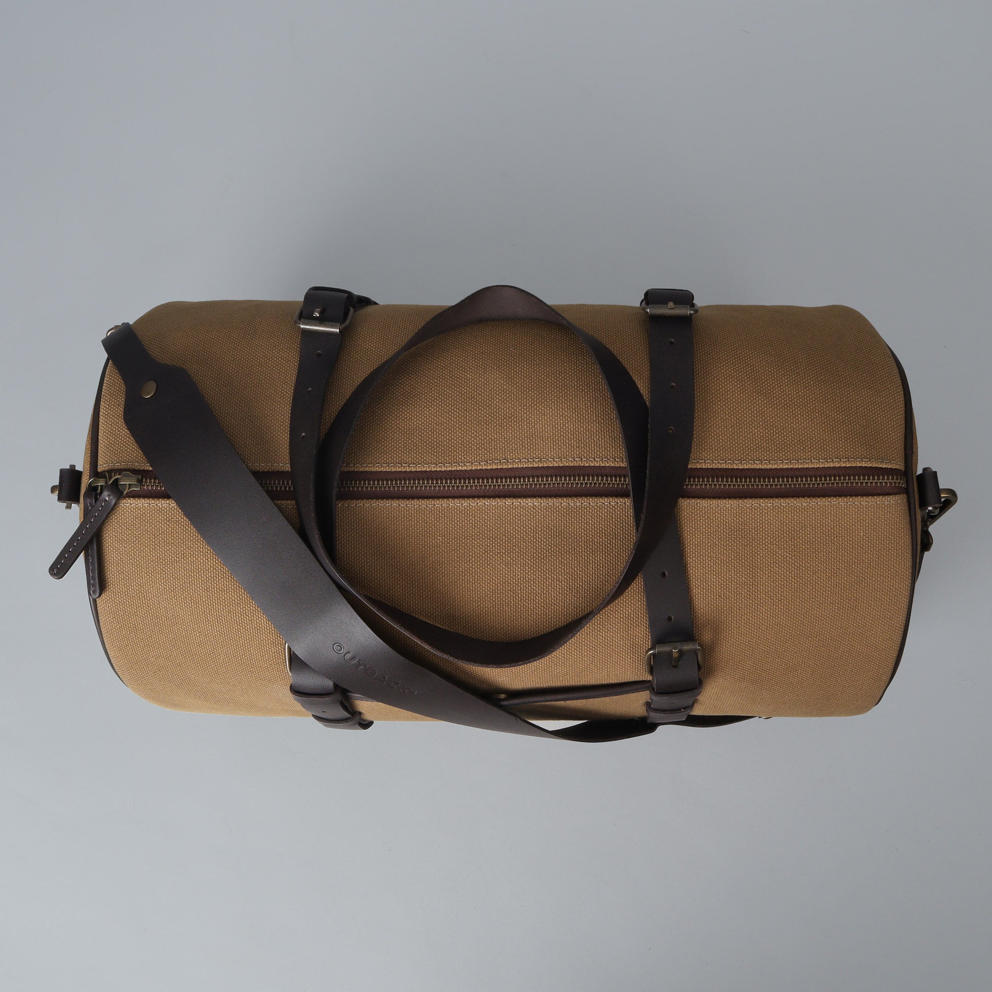 Miami Canvas Gym Bag featuring durable cotton canvas, leather straps, and spacious compartments for gym essentials.