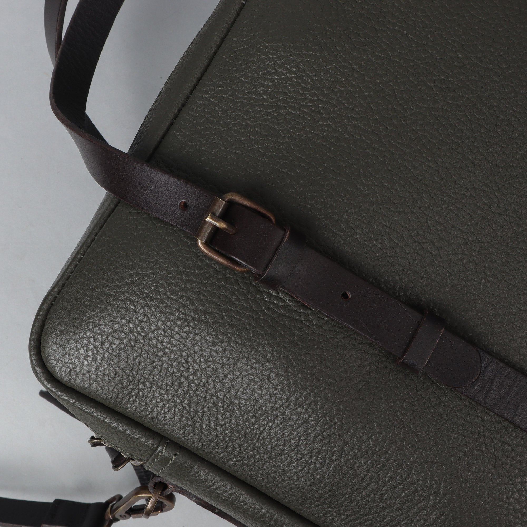 Miami Leather Briefcase showcasing premium full grain leather, spacious compartments, and adjustable shoulder strap, perfect for professionals.