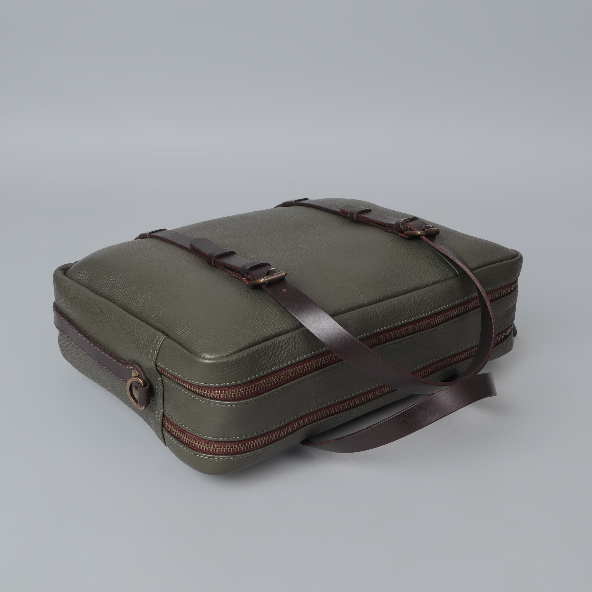 Miami Leather Briefcase showcasing premium full grain leather, spacious compartments, and adjustable shoulder strap, perfect for professionals.