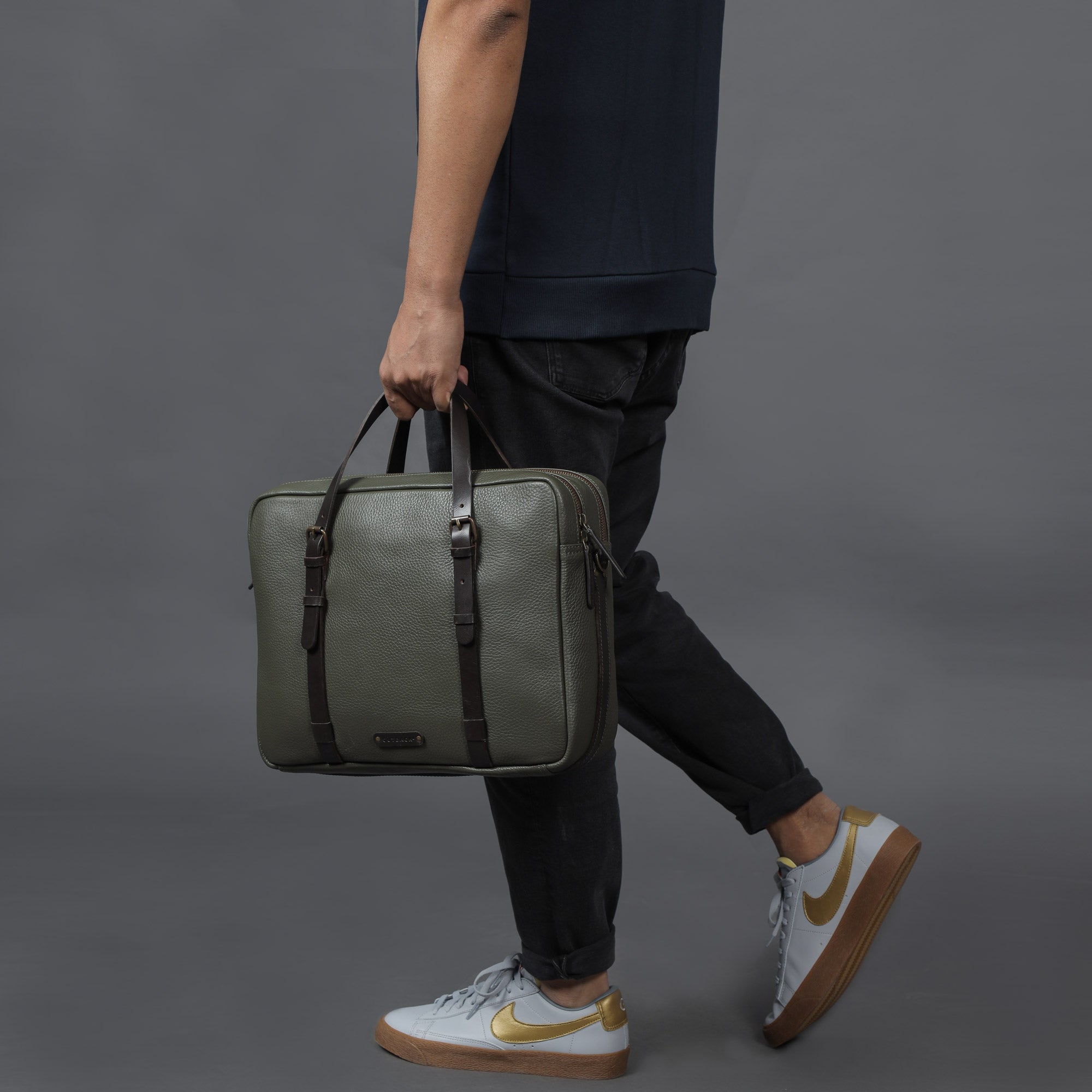 Miami Leather Briefcase showcasing premium full grain leather, spacious compartments, and adjustable shoulder strap, perfect for professionals.