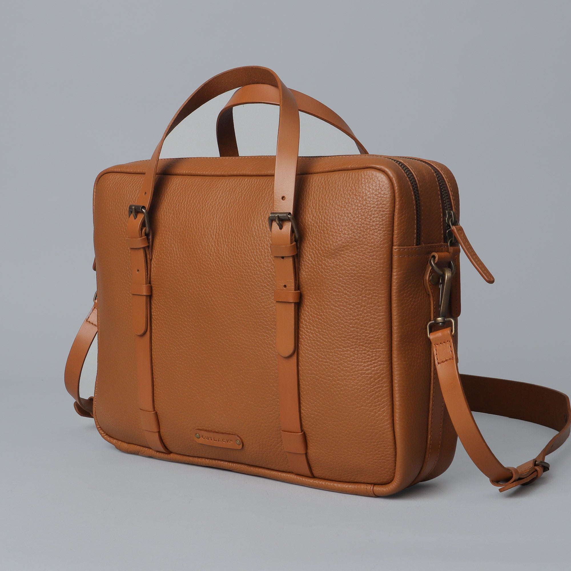 Miami Leather Briefcase showcasing premium full grain leather, spacious compartments, and adjustable shoulder strap.