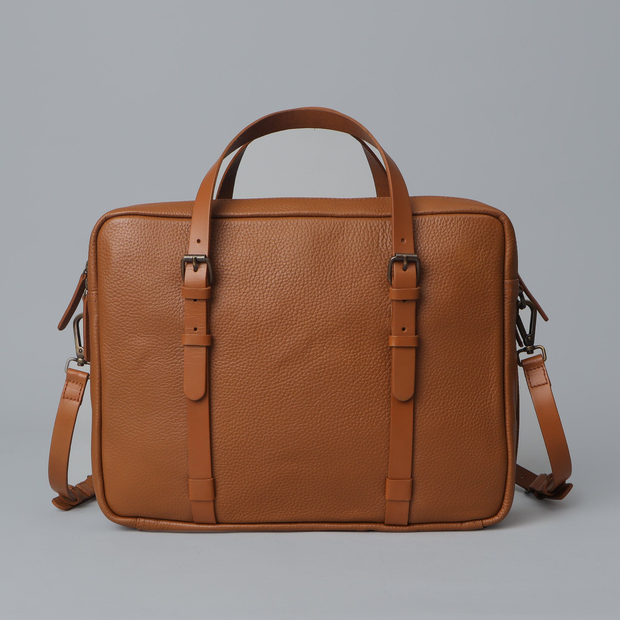 Miami Leather Briefcase showcasing premium full grain leather, spacious compartments, and adjustable shoulder strap.