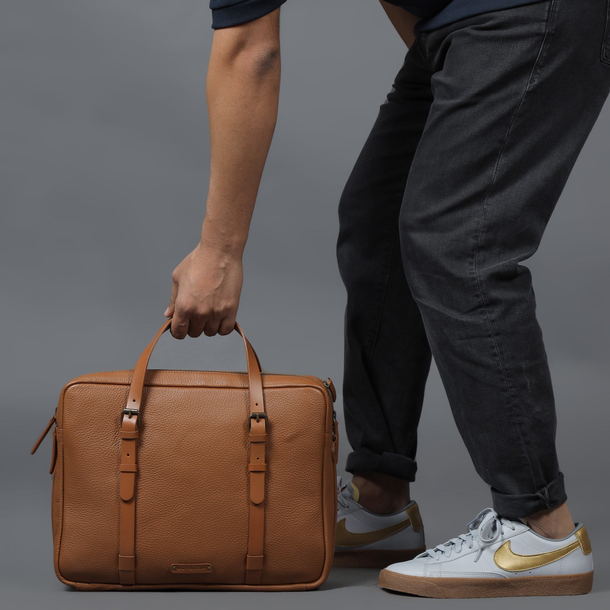 Miami Leather Briefcase showcasing premium full grain leather, spacious compartments, and adjustable shoulder strap.