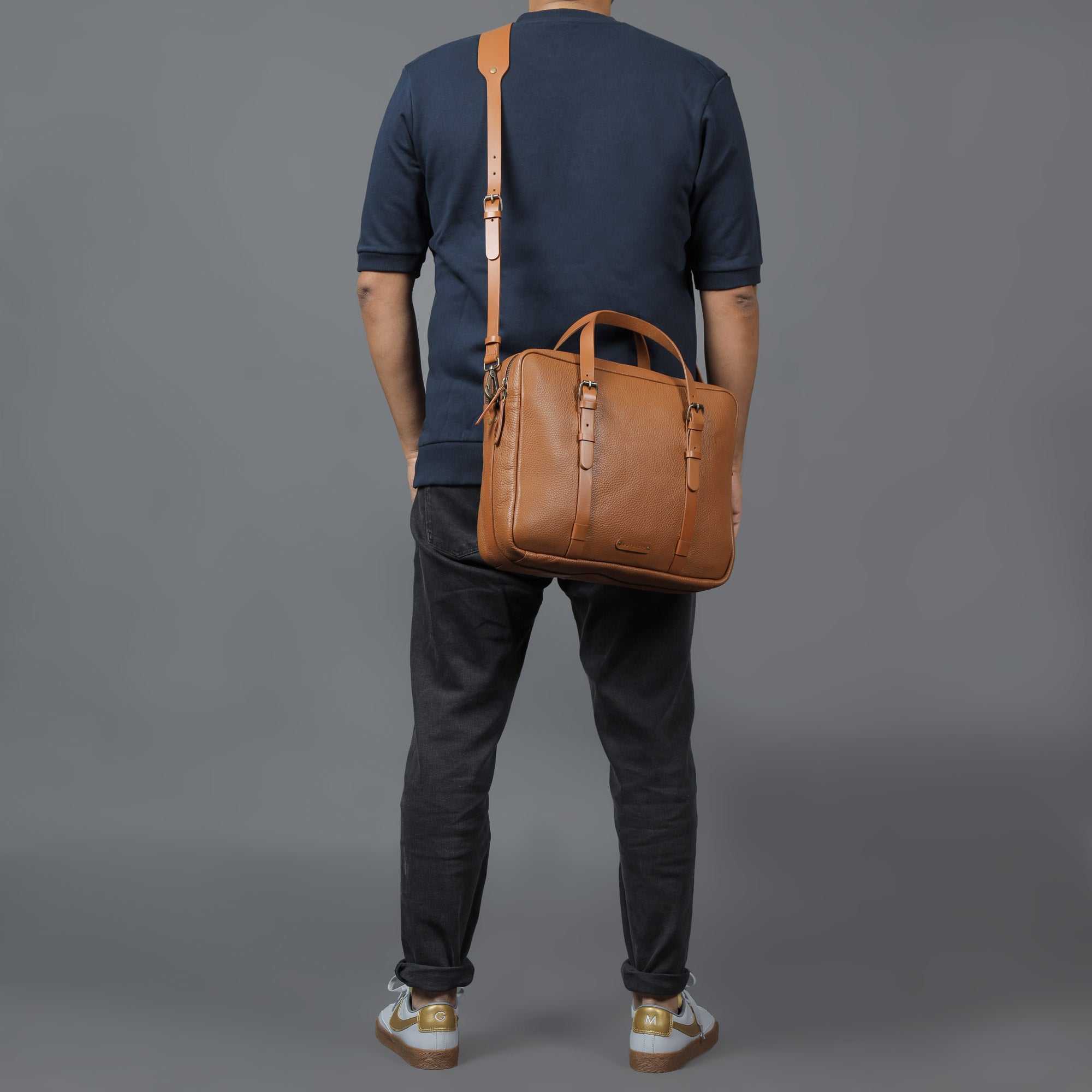 Miami Leather Briefcase showcasing premium full grain leather, spacious compartments, and adjustable shoulder strap.