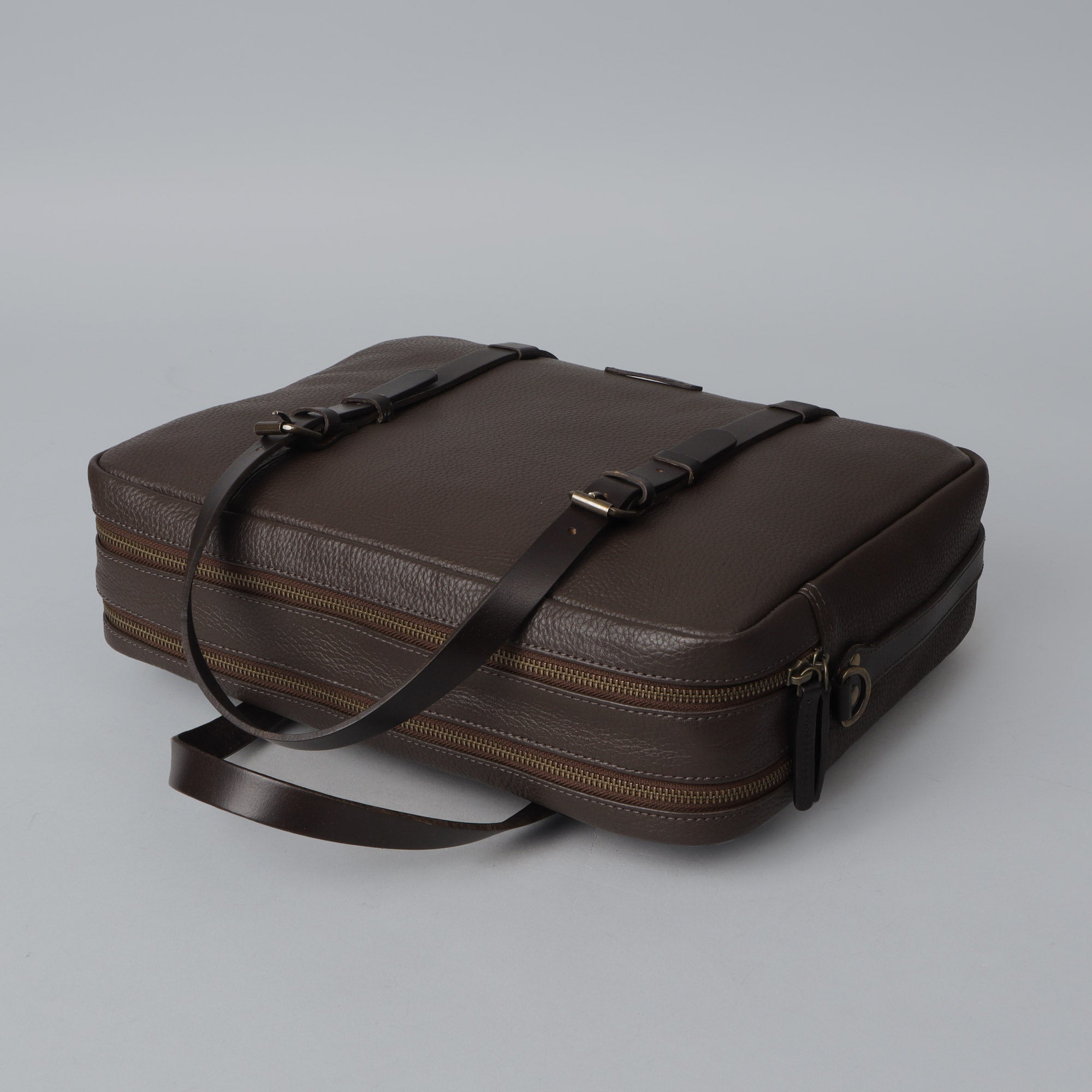 Miami Leather Briefcase showcasing premium full grain leather, spacious compartments, and adjustable shoulder strap.