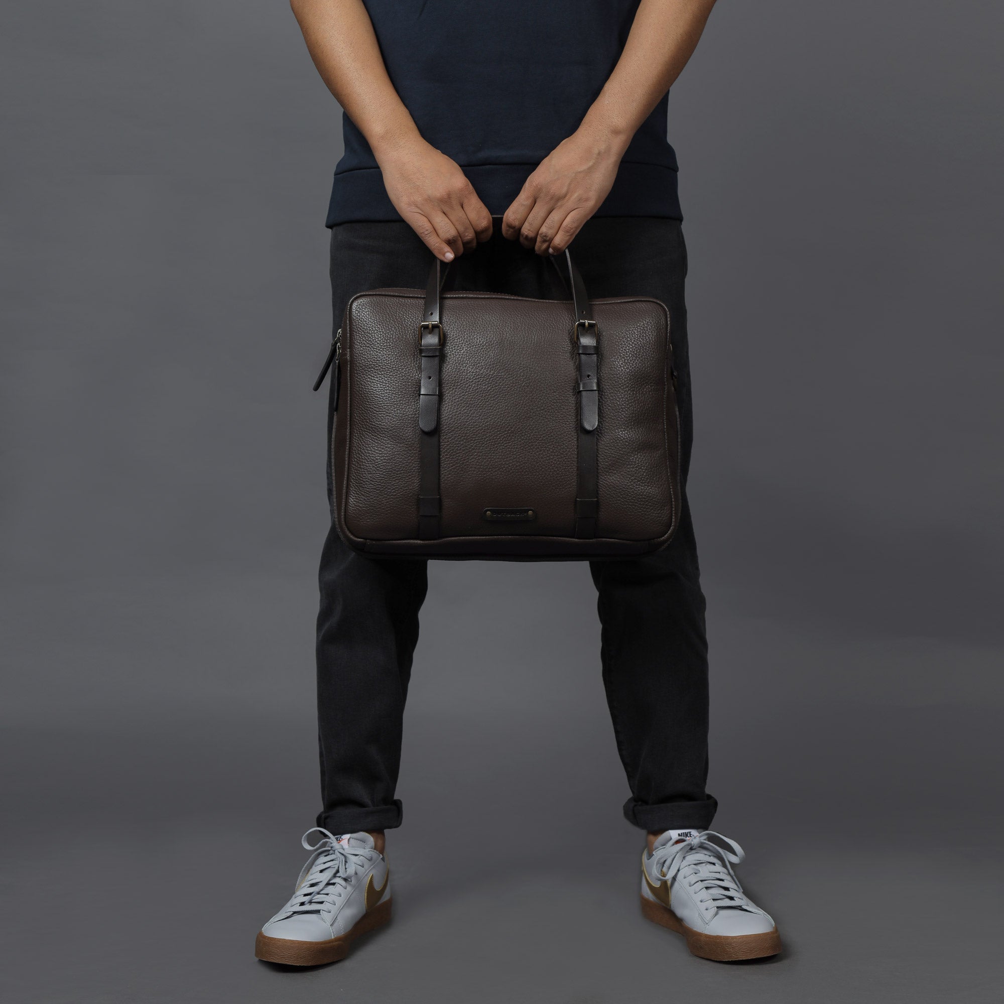 Miami Leather Briefcase showcasing premium full grain leather, spacious compartments, and adjustable shoulder strap.