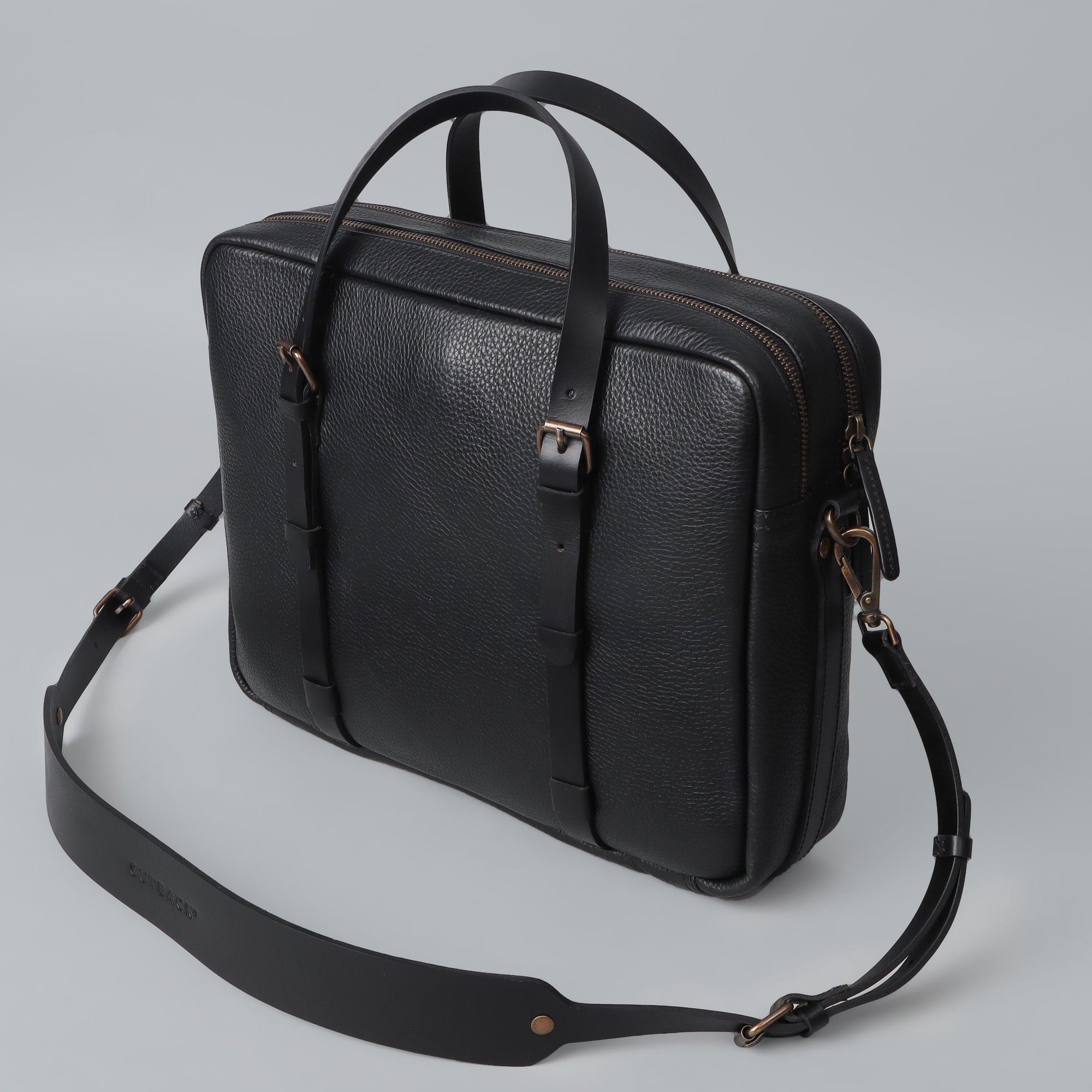 Miami Leather Briefcase showcasing premium full grain leather, spacious compartments, and antique brass hardware.