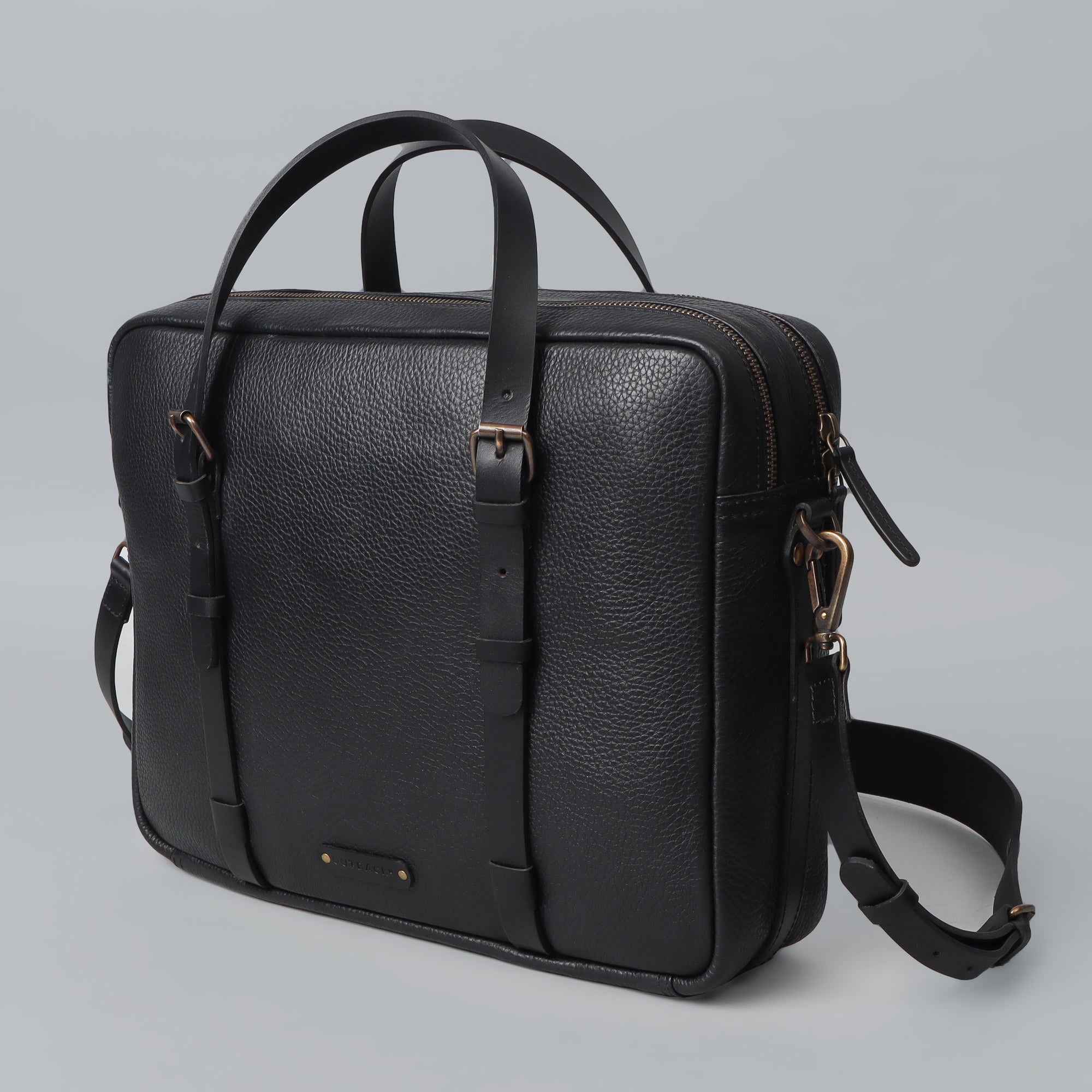 Miami Leather Briefcase showcasing premium full grain leather, spacious compartments, and antique brass hardware.