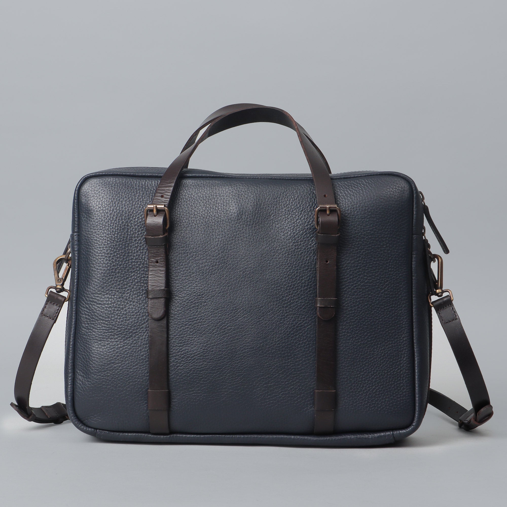 Miami Leather Briefcase showcasing premium full grain leather, spacious compartments, and adjustable shoulder strap, perfect for professionals.