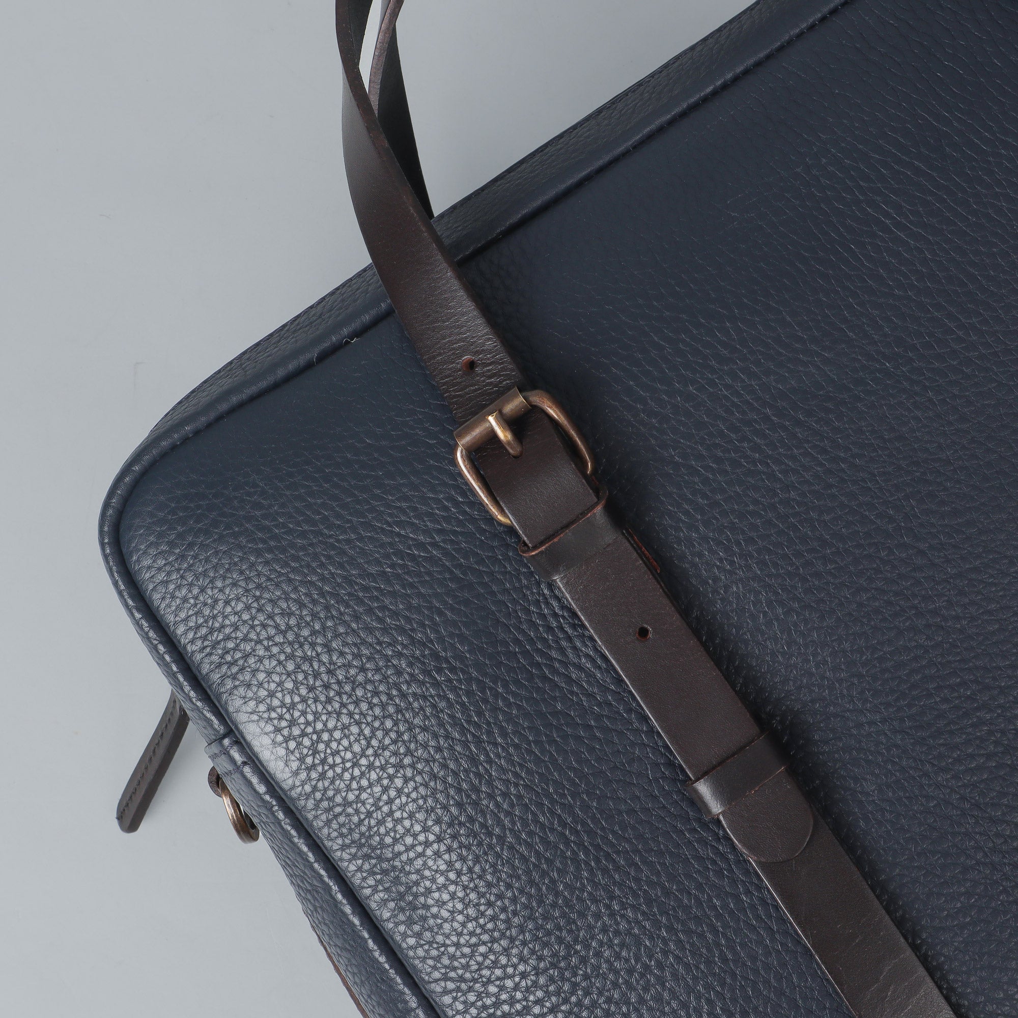 Miami Leather Briefcase showcasing premium full grain leather, spacious compartments, and adjustable shoulder strap, perfect for professionals.