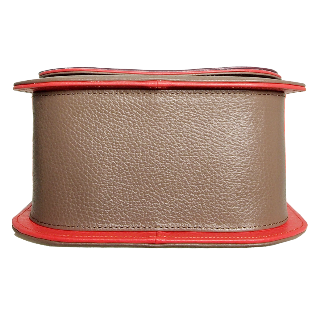 A stylish Midi Shoulder Bag in taupe leather with coral red trimming, showcasing its handcrafted design and spacious interior.