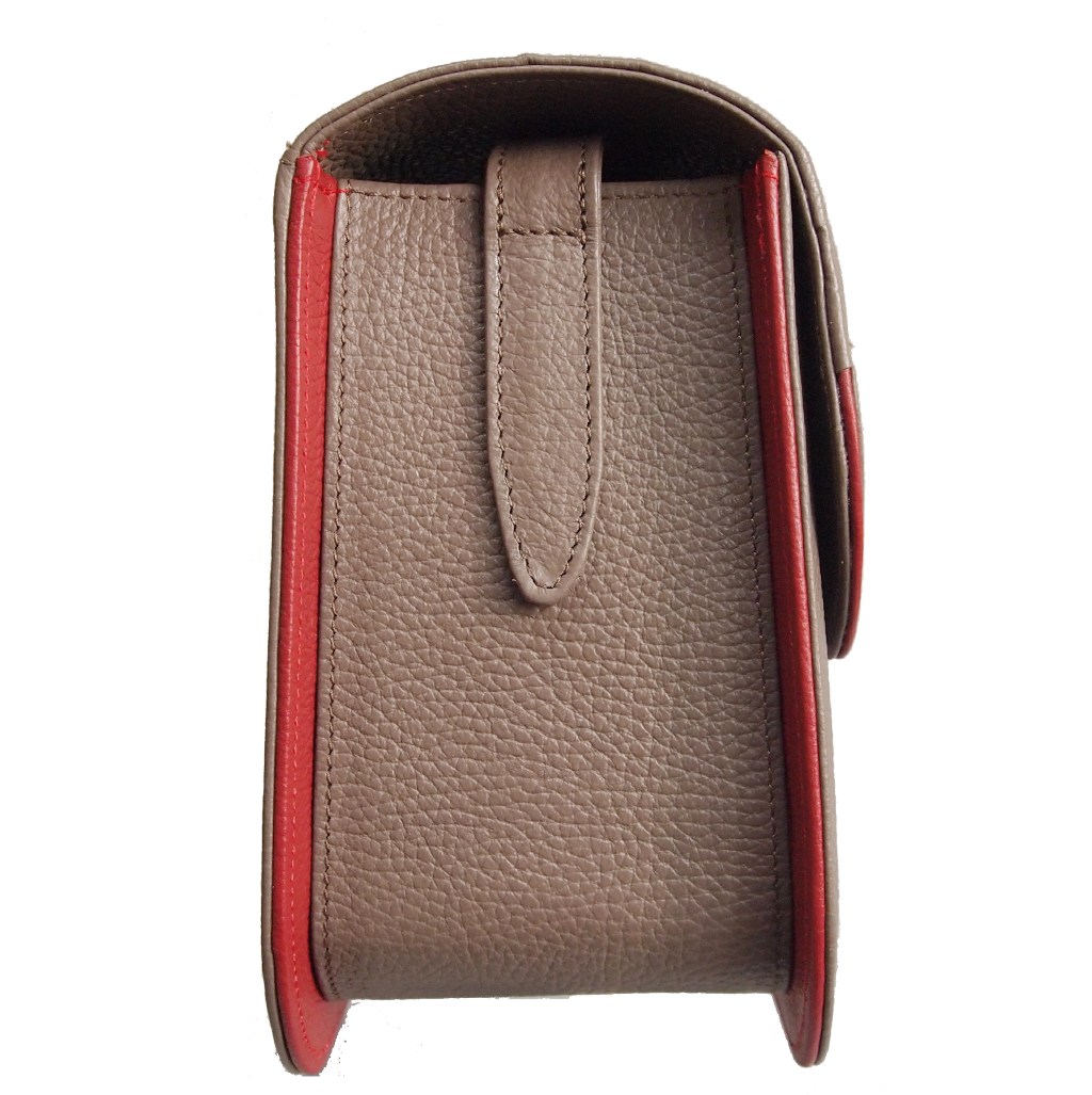 A stylish Midi Shoulder Bag in taupe leather with coral red trimming, showcasing its handmade craftsmanship and spacious interior.