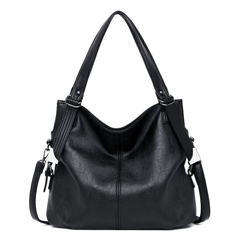 A stylish middle-aged women's vintage PU leather messenger bag in a square shape, featuring a soft handle and a plain pattern, ideal for everyday use.