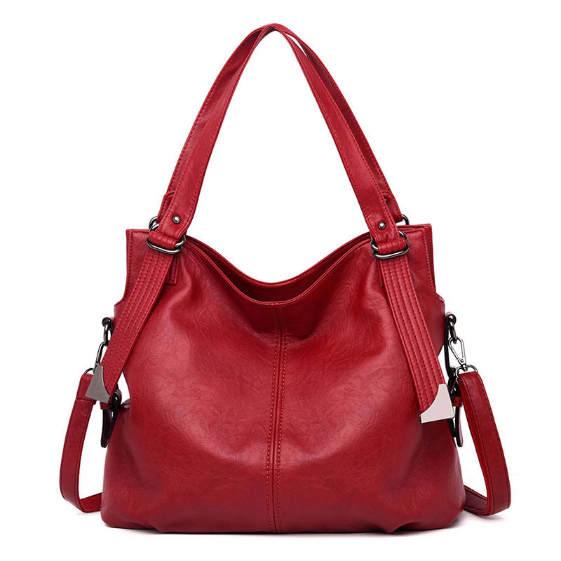 A stylish middle-aged women's vintage PU leather messenger bag in a square shape, featuring a soft handle and a plain pattern, ideal for everyday use.