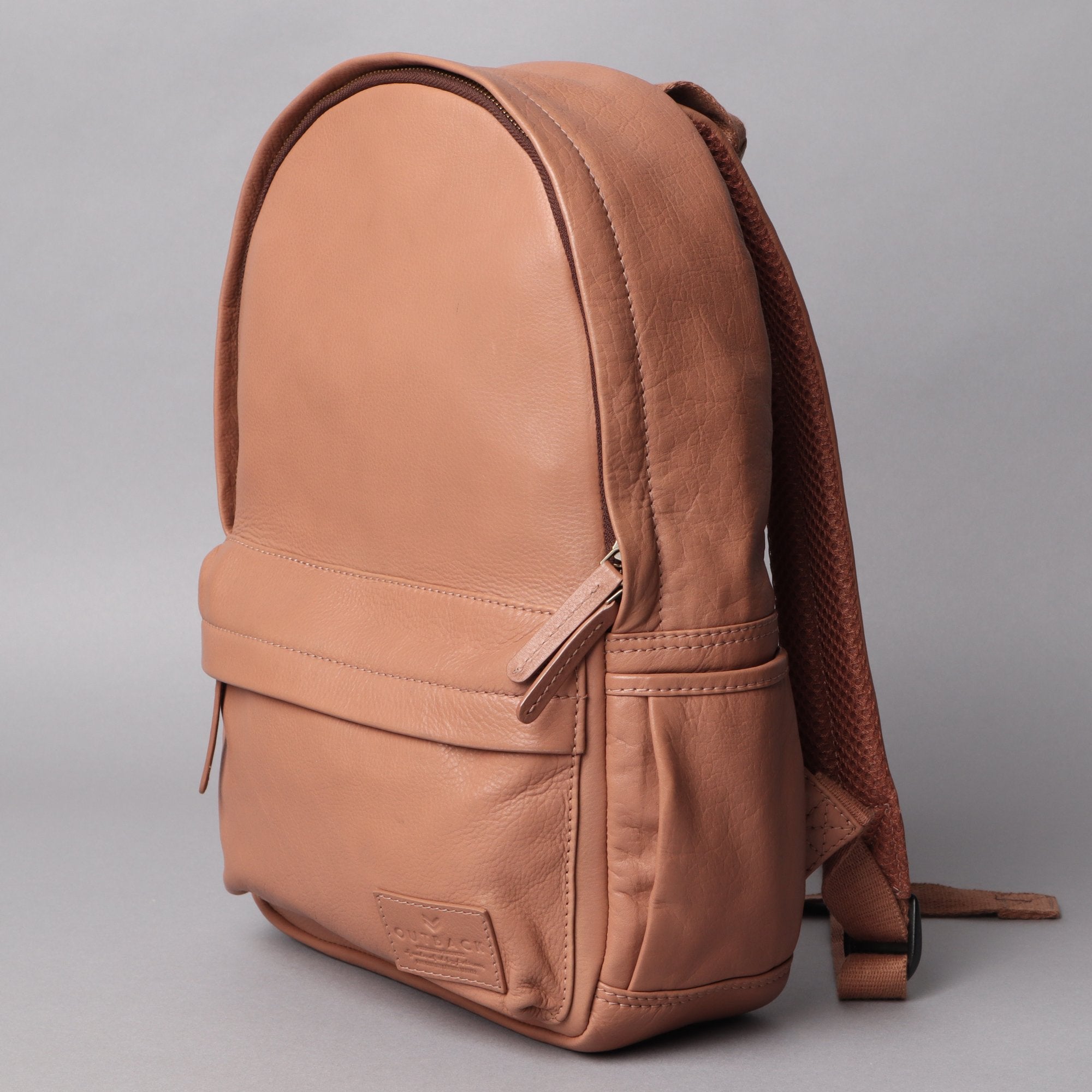 Mini Journey Leather Backpack made from premium full grain leather, featuring adjustable straps and multiple pockets for convenience.