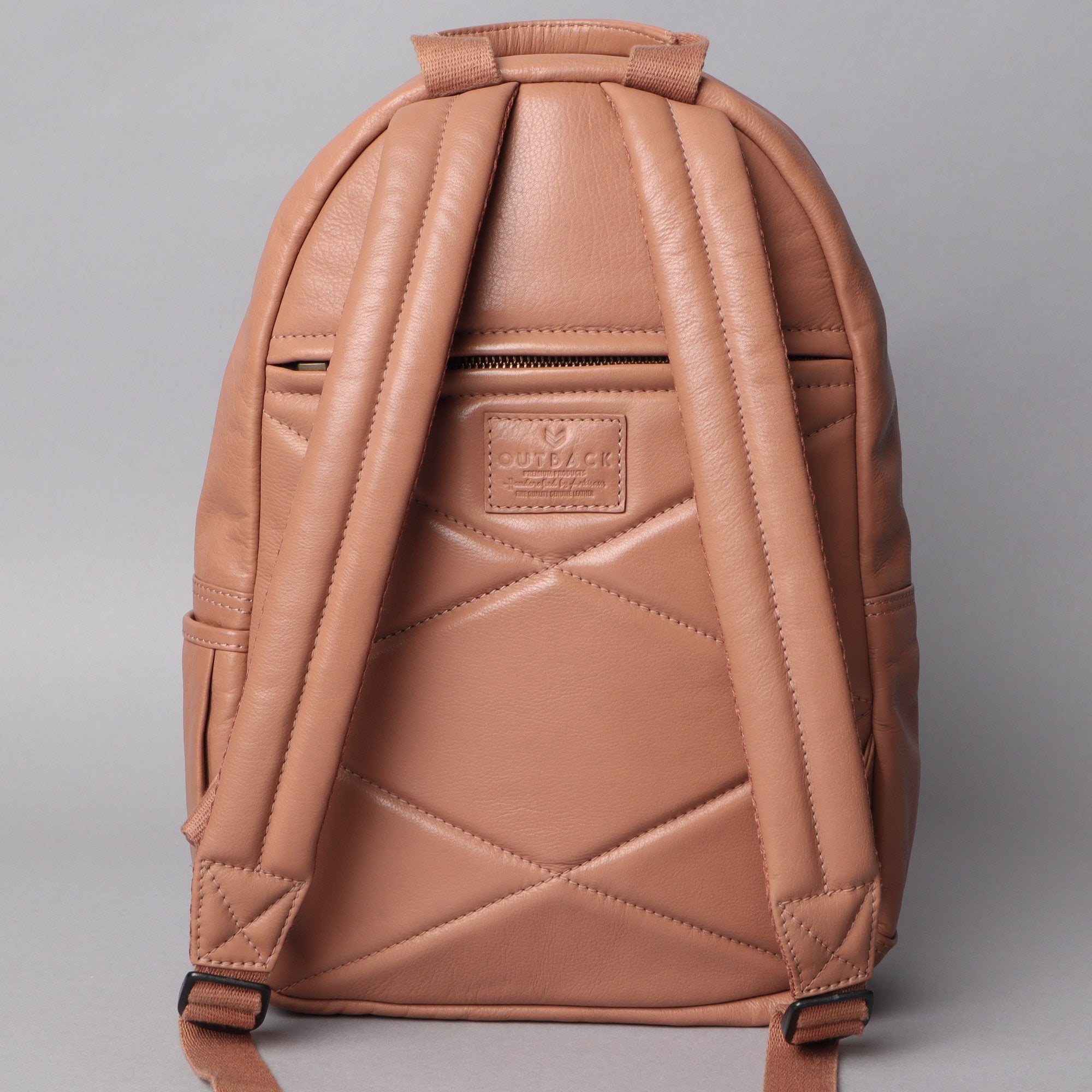 Mini Journey Leather Backpack made from premium full grain leather, featuring adjustable straps and multiple pockets for convenience.