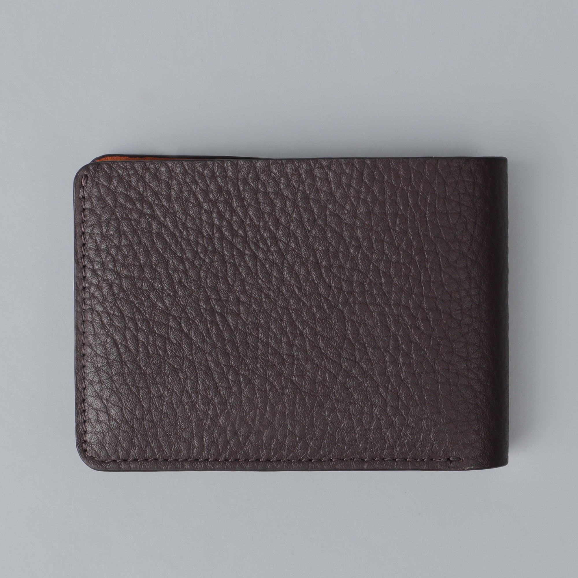 A sleek Minimal Wallet made of premium genuine leather, featuring multiple card pockets and a compact design, ideal for everyday use.