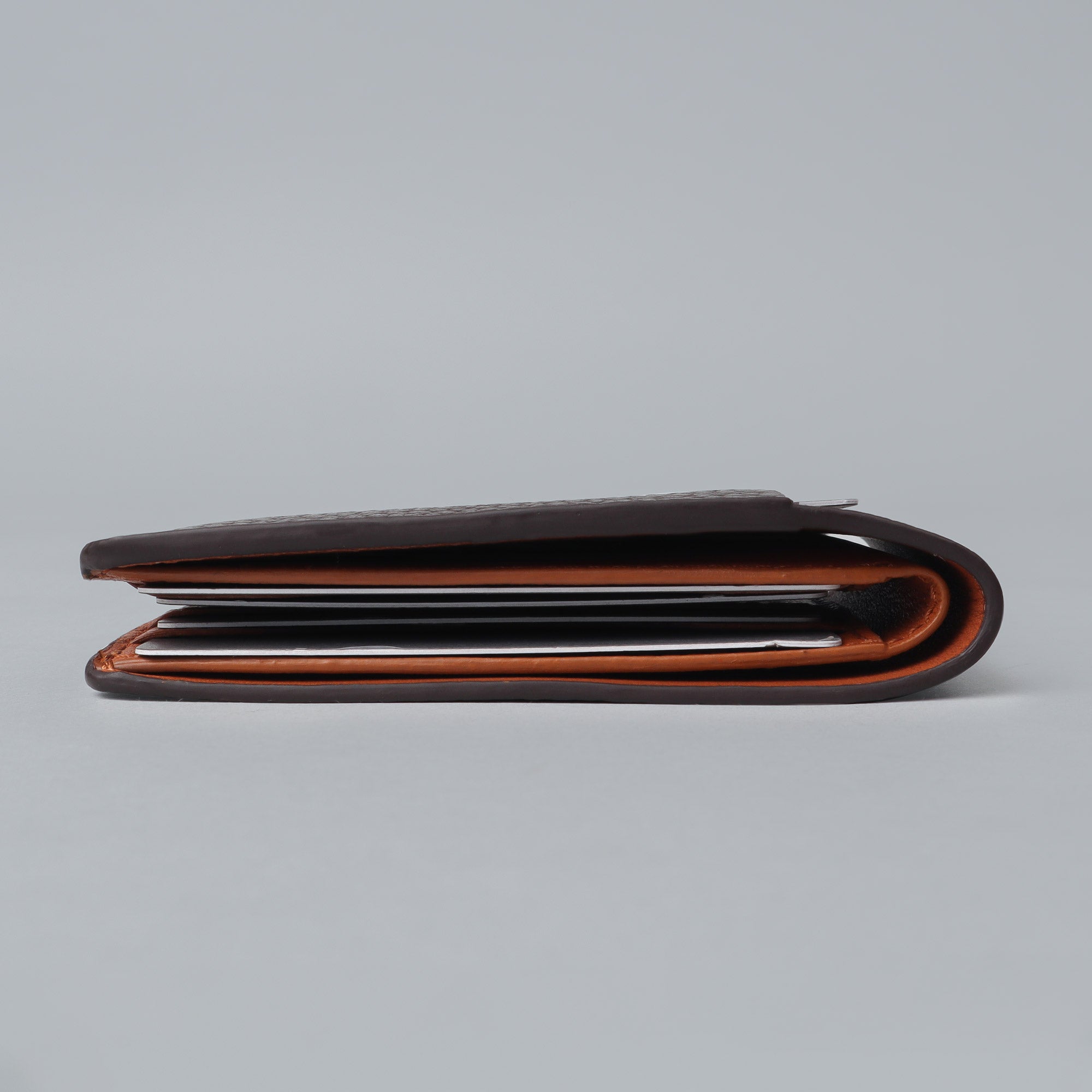 A sleek Minimal Wallet made of premium genuine leather, featuring multiple card pockets and a compact design, ideal for everyday use.