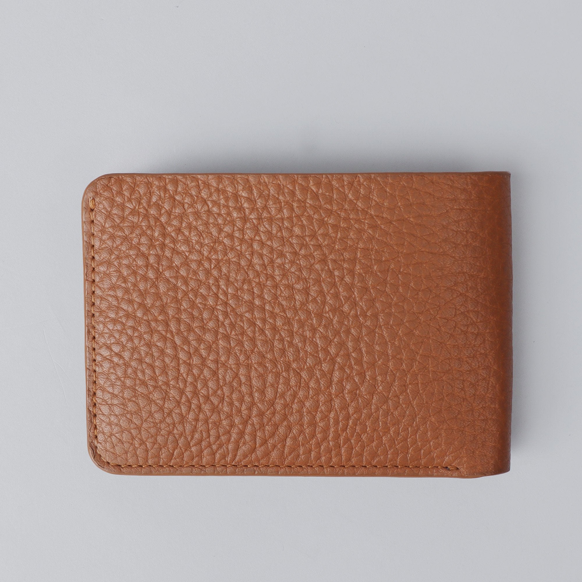 A sleek Minimal Wallet made of premium genuine leather, featuring multiple card pockets and a compact design.