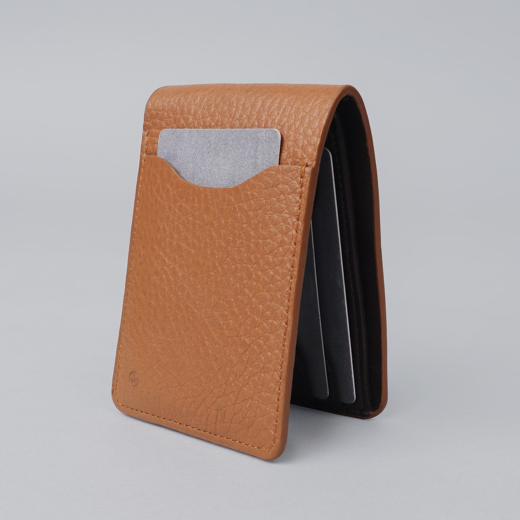 A sleek Minimal Wallet made of premium genuine leather, featuring multiple card pockets and a compact design.