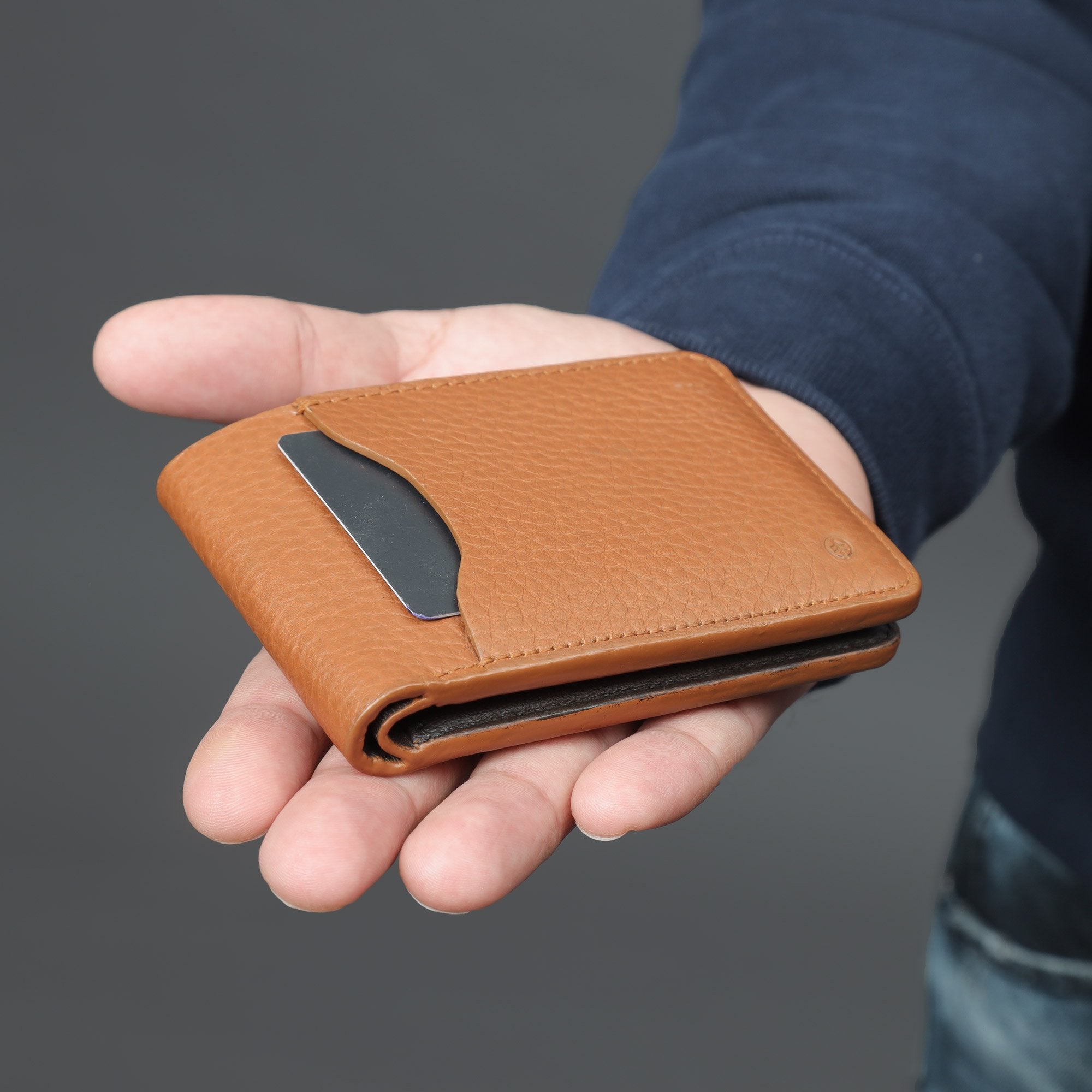 A sleek Minimal Wallet made of premium genuine leather, featuring multiple card pockets and a compact design.