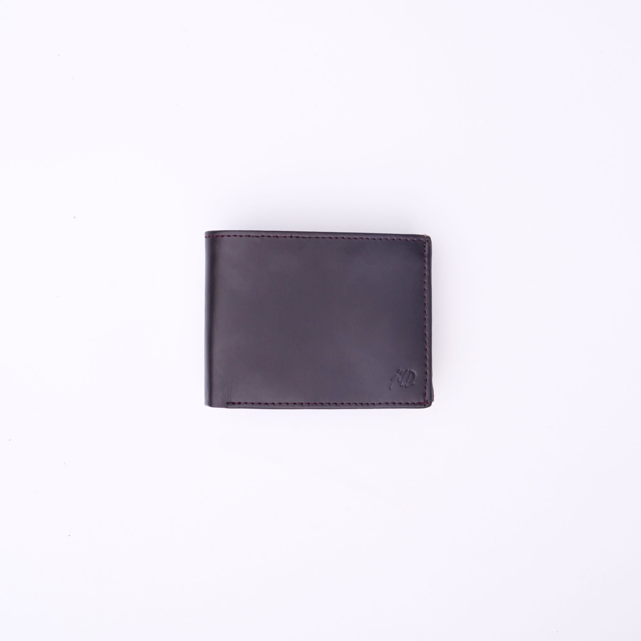 A sleek Minimalist Men's Leather Bi-Fold Wallet showcasing its pure leather finish and multiple card slots.