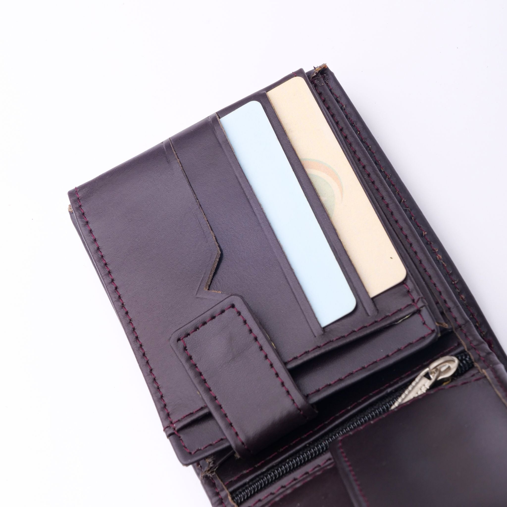 A sleek Minimalist Men's Leather Bi-Fold Wallet showcasing its pure leather finish and multiple card slots.