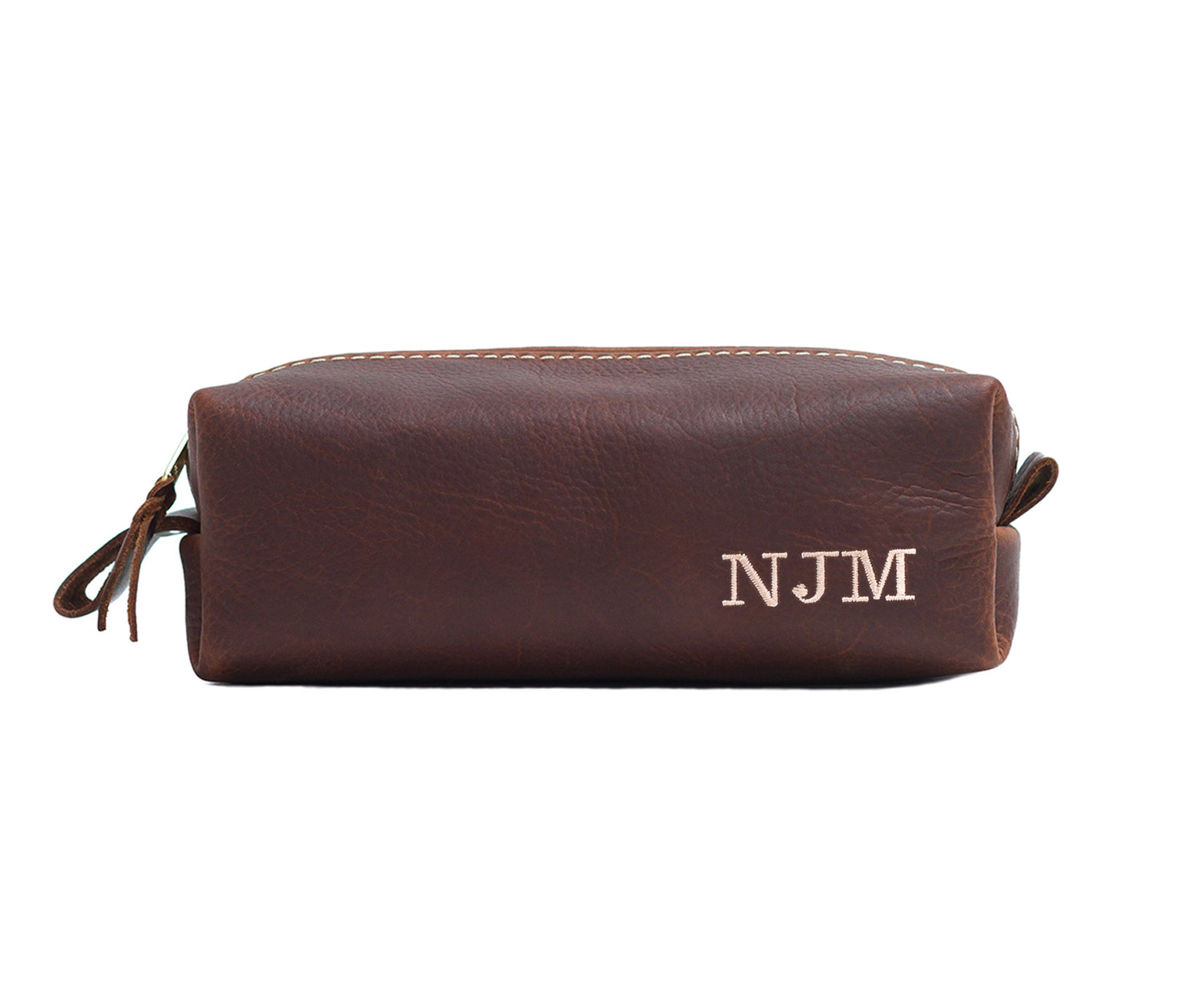 A stylish Minimalist Shave Bag made from premium leather, featuring a durable nylon lining and a brass zipper, perfect for travel.