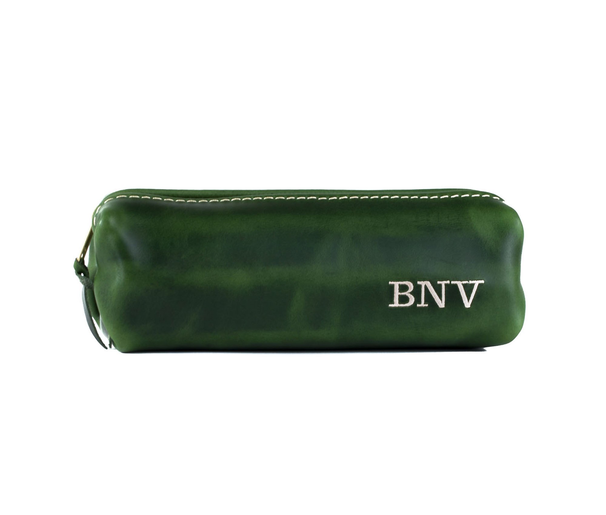 A stylish Minimalist Shave Bag made from premium leather, featuring a durable nylon lining and a brass zipper, perfect for travel.