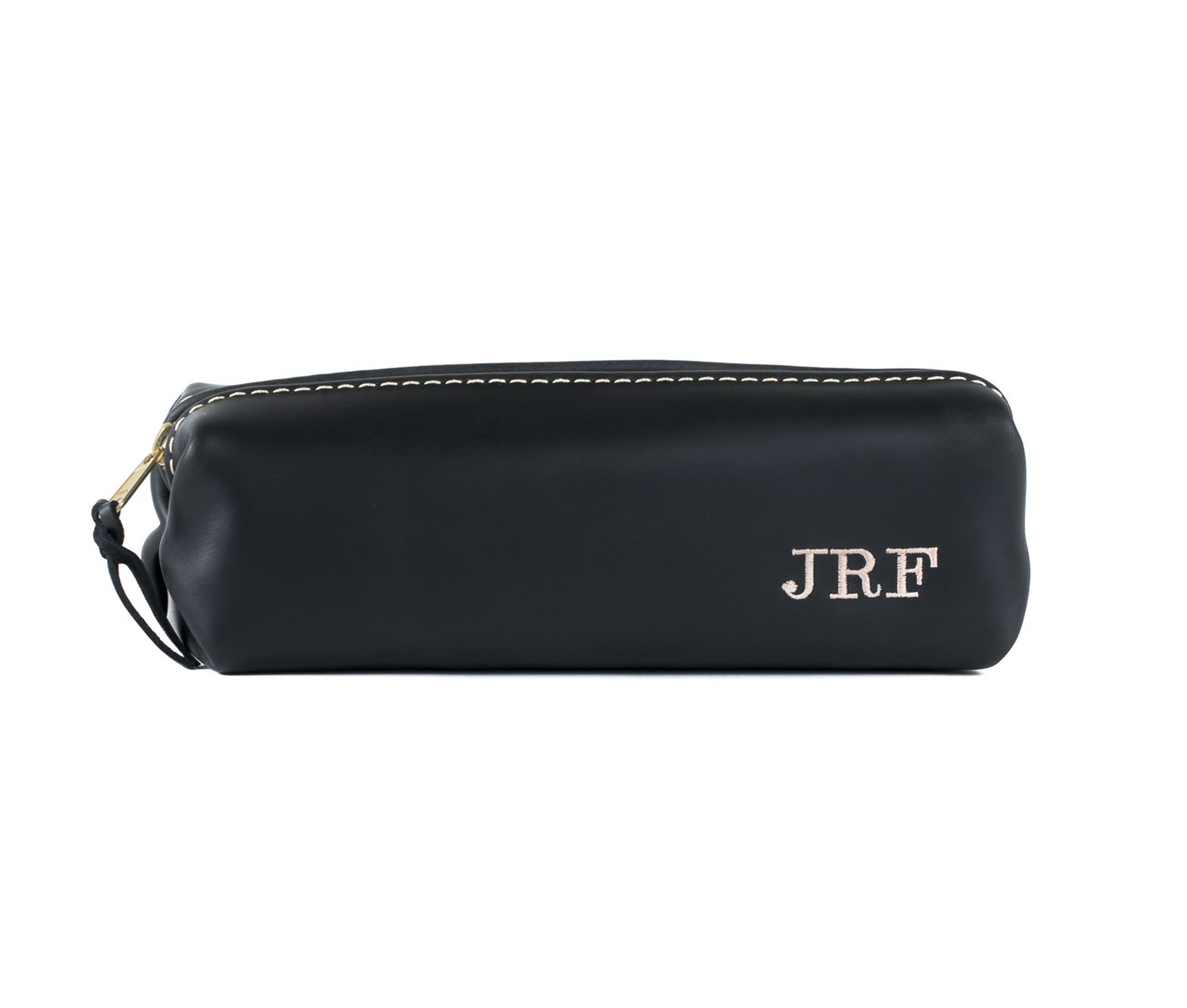 A stylish Minimalist Shave Bag made from premium leather, featuring a durable nylon lining and a brass zipper, perfect for travel.