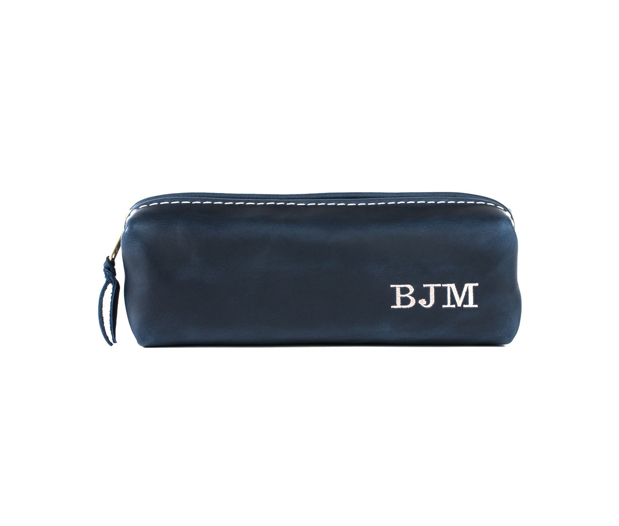 A stylish Minimalist Shave Bag made from premium leather, featuring a durable nylon lining and a brass zipper, perfect for travel.