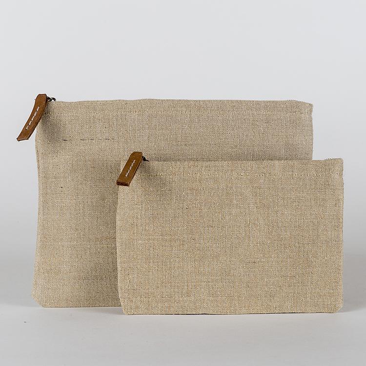 A set of two modern jute pouches with striped cotton lining and leather pulls, showcasing their elegant design and eco-friendly material.