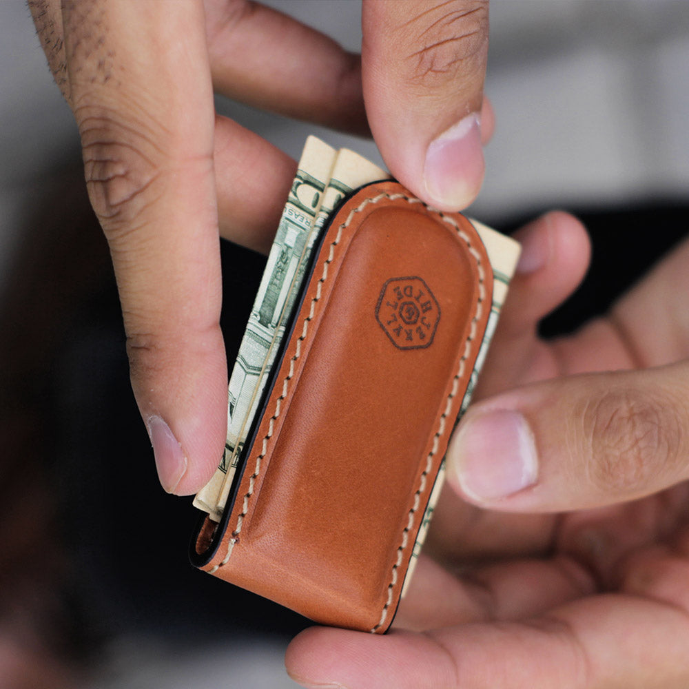 Tan leather money clip, sleek and minimalist design, perfect for cash and cards.