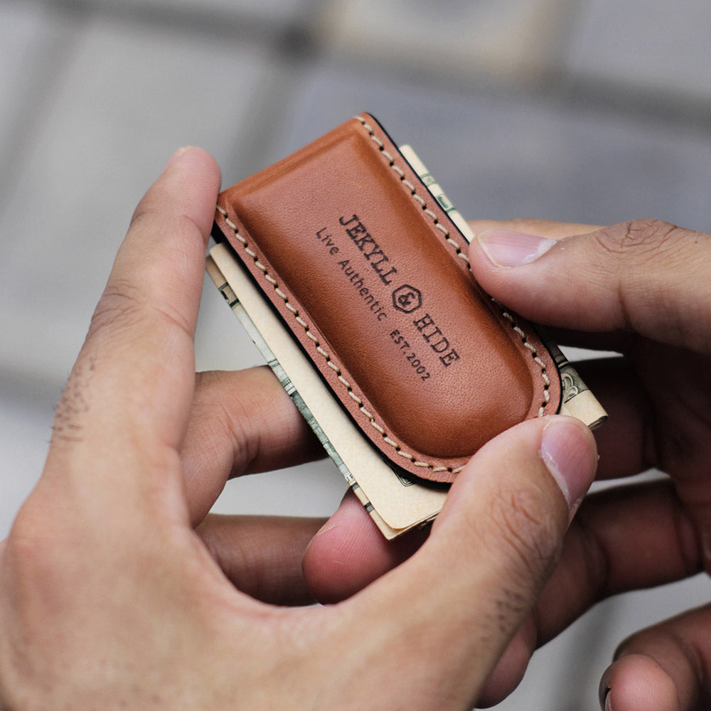 Tan leather money clip, sleek and minimalist design, perfect for cash and cards.