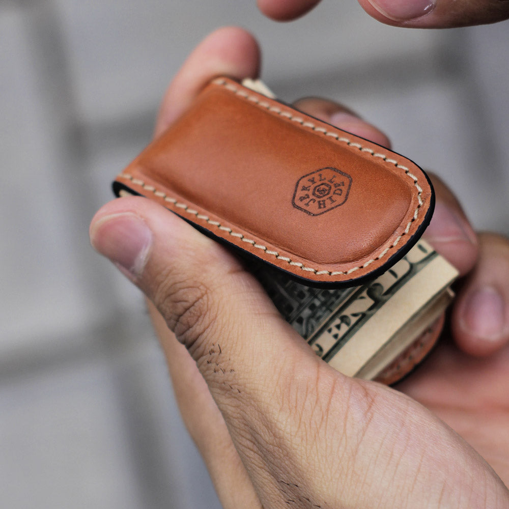 Tan leather money clip, sleek and minimalist design, perfect for cash and cards.