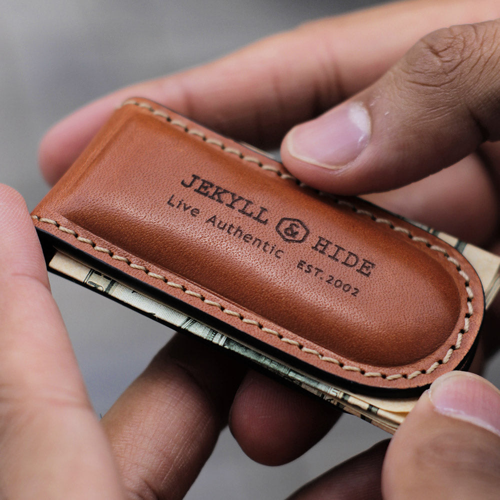 Tan leather money clip, sleek and minimalist design, perfect for cash and cards.