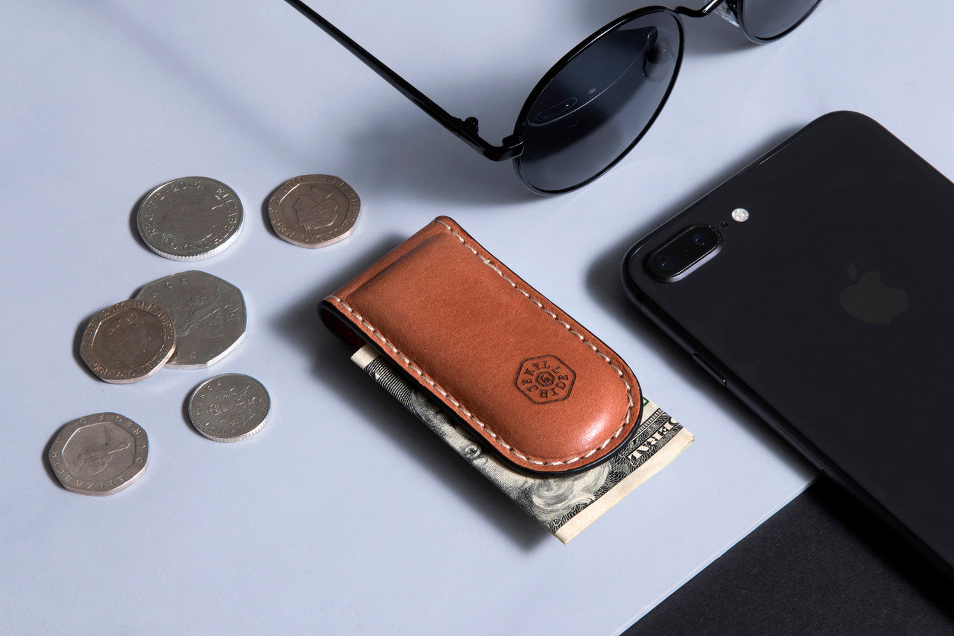 Tan leather money clip, sleek and minimalist design, perfect for cash and cards.