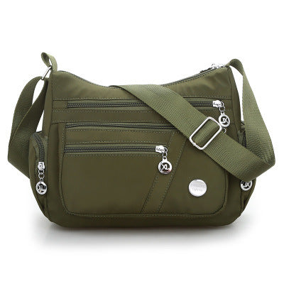 Multi-Compartment Casual One-Shoulder Messenger Bag in Oxford fabric with zipper opening and telescopic handle.